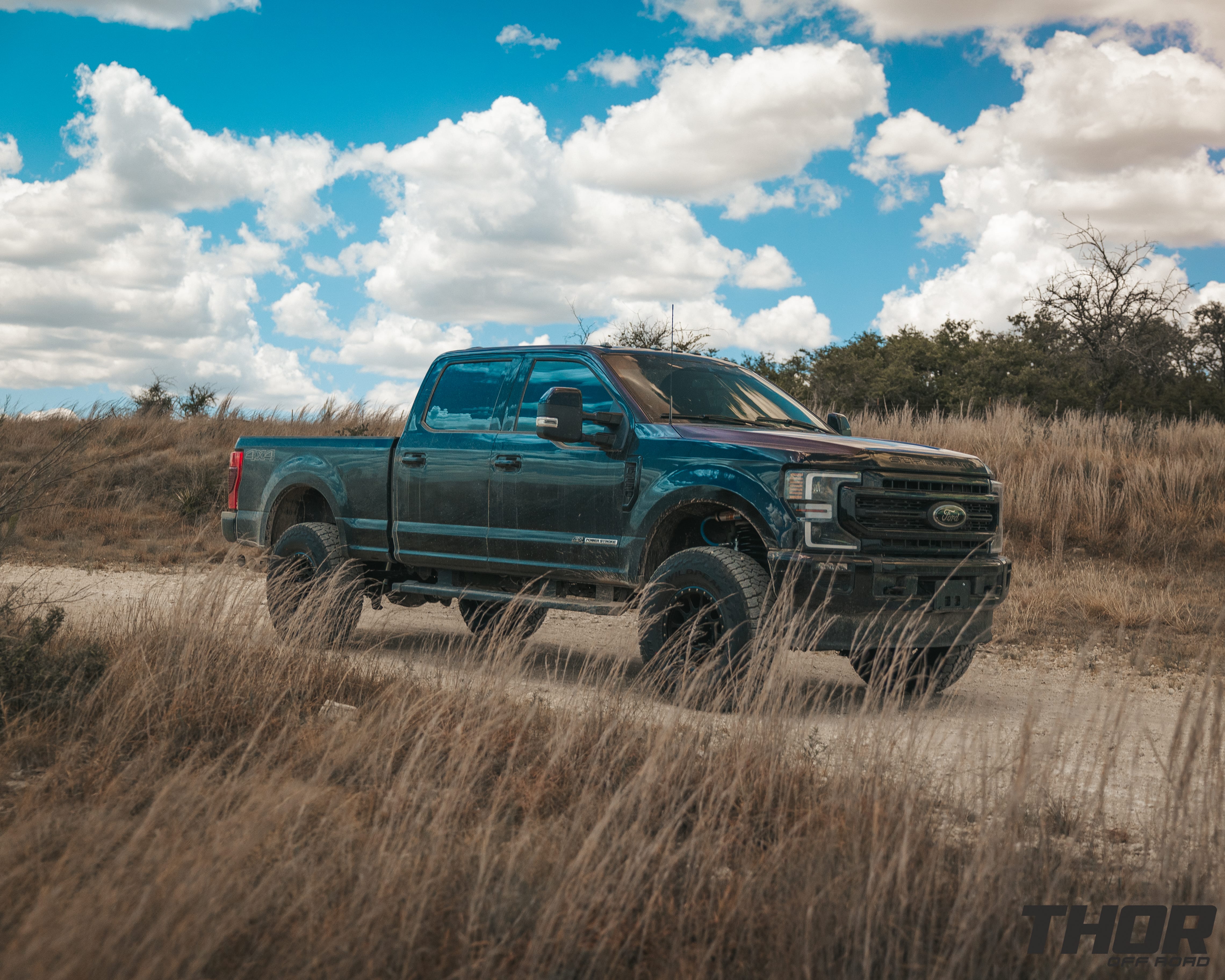 2022 Ford F-250 Super Duty Lariat in Black with Carli 3.5" Pintop Suspension Kit, Carli Torsion Sway Bar, Carli High Mount Steering Stabilizer, Carli Low Mount Steering Stabilizer, Carli Radius Arms, Air Bag Lift Kit with Wireless Controller, 18x9" Method MR305 NV Matte Black Wheels, 37x12.50R18 Falken Wildpeak A/T3W Tires