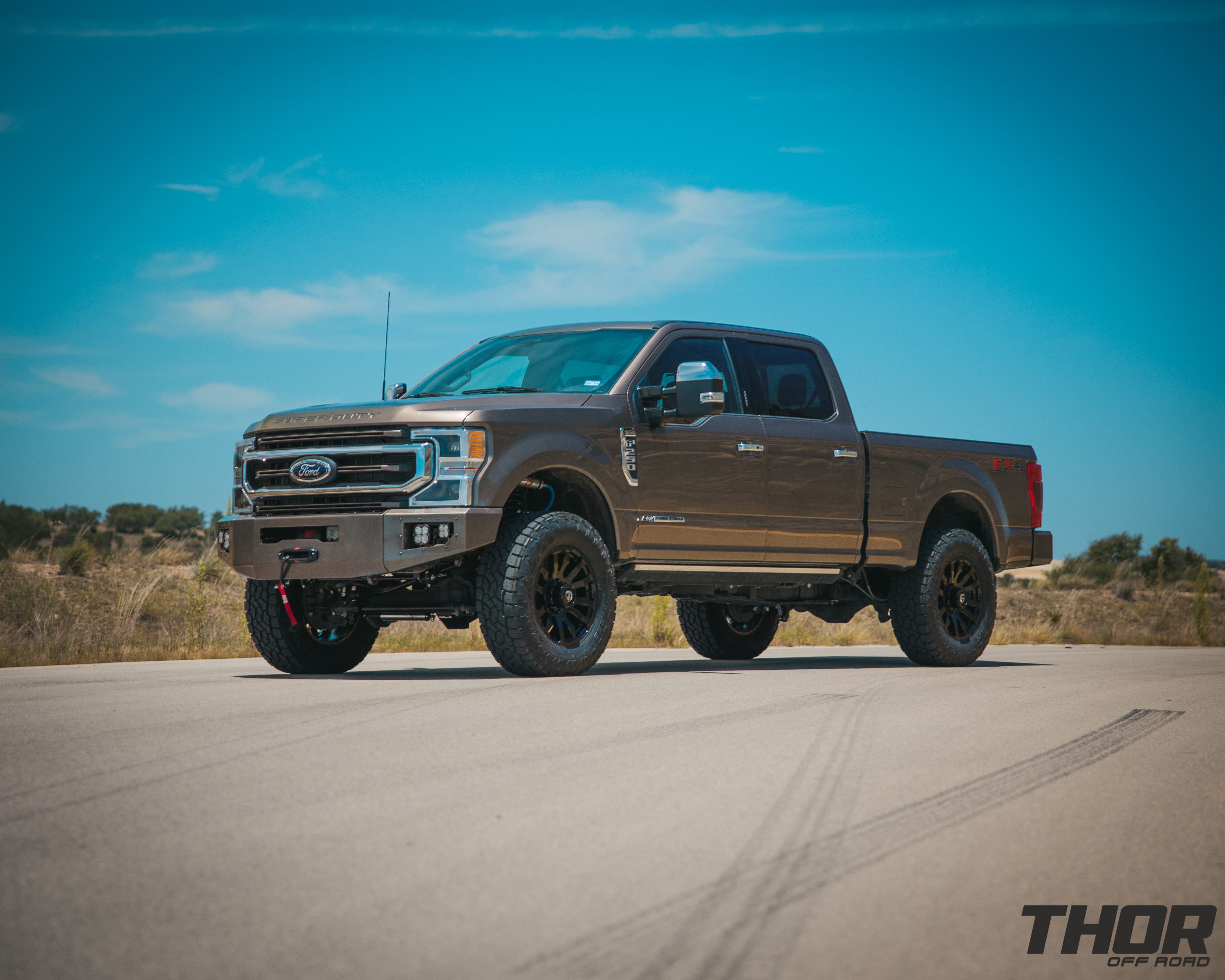 2022 Ford F-250 Super Duty King Ranch in Stone Grey with 3.5" Carli King Pintop Suspension Kit, Carli Torsion Sway Bar, Carli Fabricated Radius Arms, Carli Rear Full Leaf Springs, 20" Fuel Blitz Wheels, 37x12.50R20 Toyo ATIII Tires, CJC Front and Rear Bumpers, Baja Design XL Squadron Lighting, Warn 12S Winch