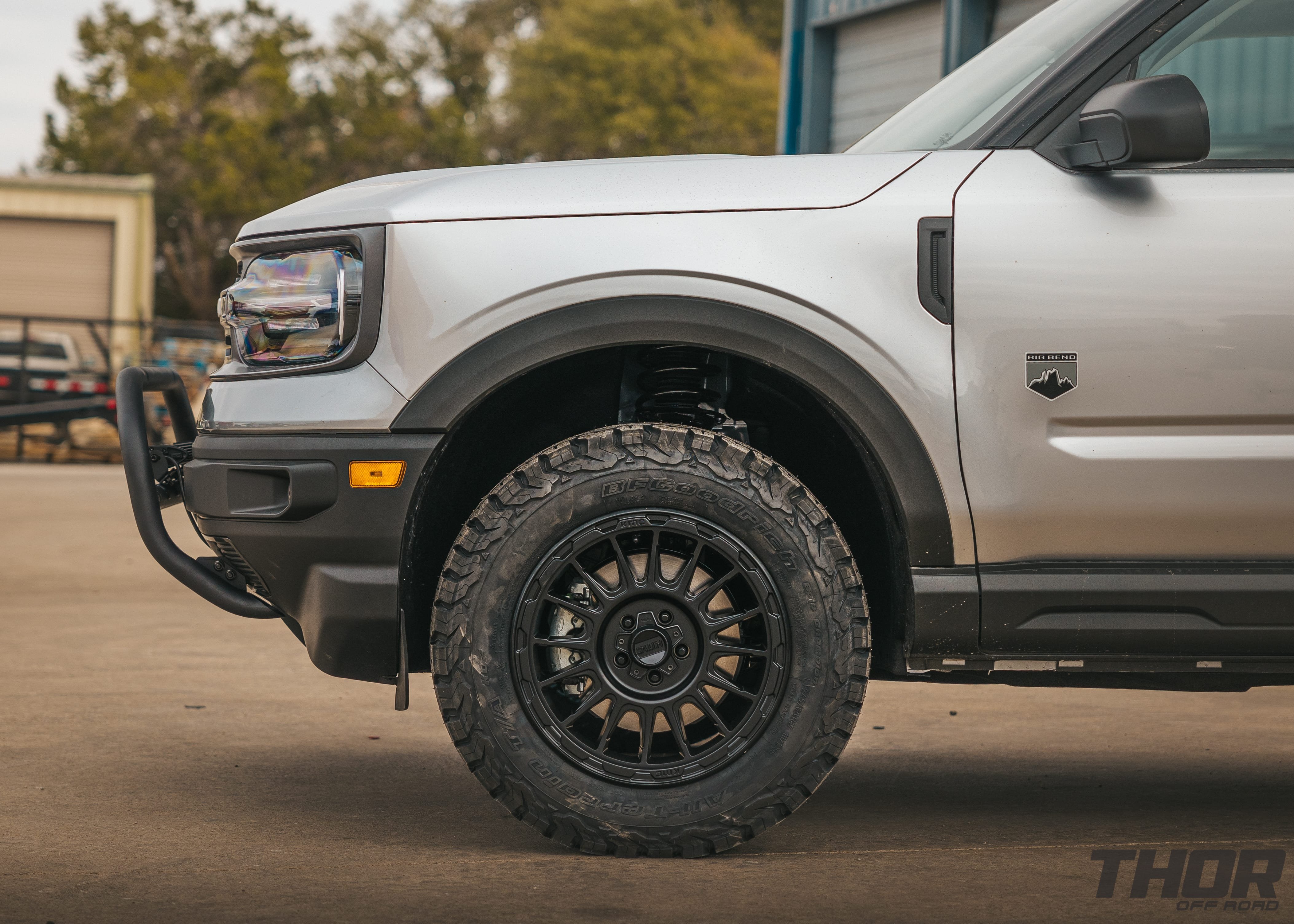 2021 Ford Bronco Big Bend in Silver with 1.5" ReadyLift Suspension Kit, 17x8" KMC Wheels, 265/45R17 BFG Tires, Rough Counttry Nudge Bar, 20" Bumper Light Bar