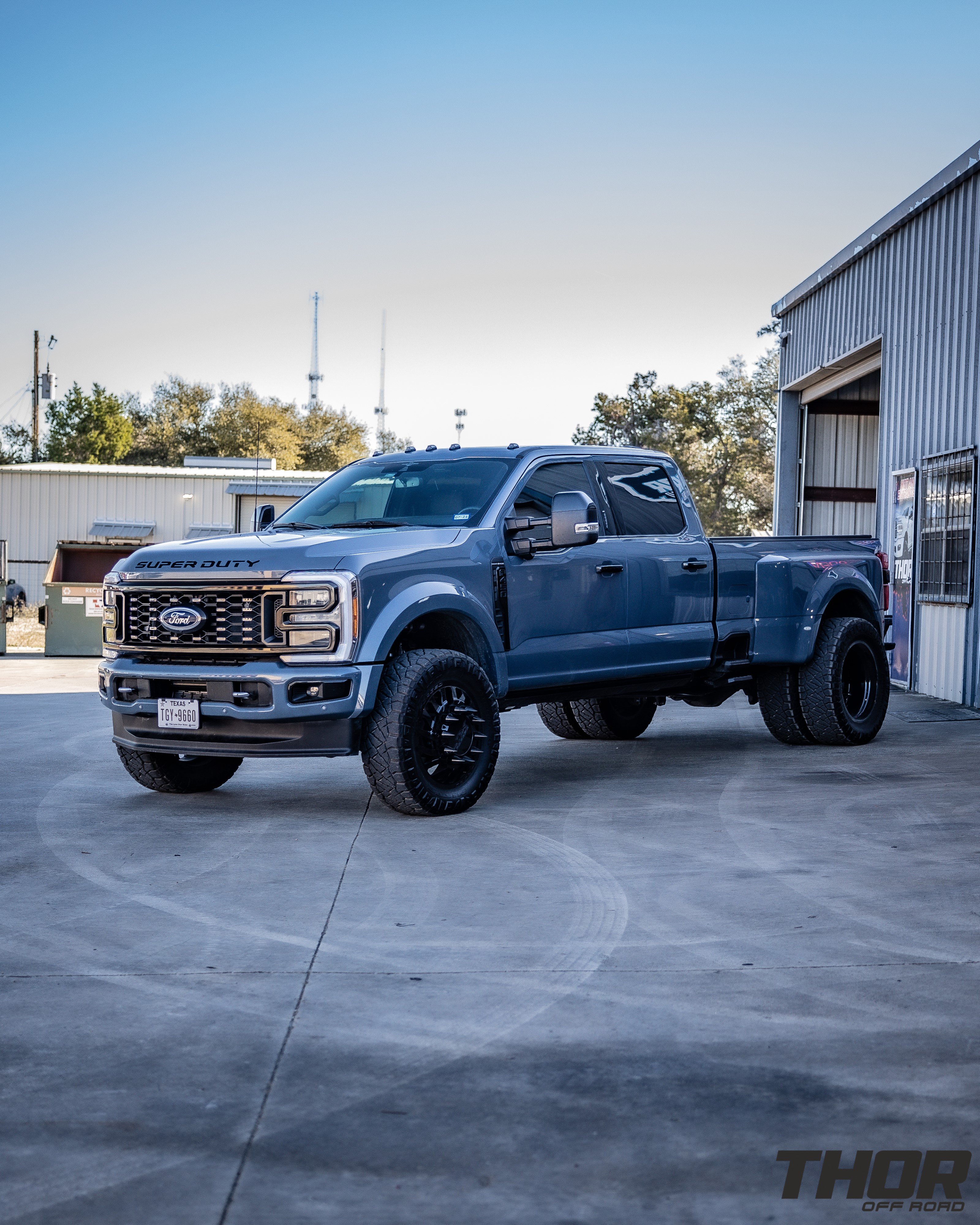 2023 Ford F-450 Super Duty Platinum in Blue with Carli 3.5" E-Venture System, Carli Full Rear Spring Replacement, Carli Torsion Sway Bar, PMF Steering Stabilizer, Carli 3.5" Fabricated Radius Arms, JTX Centerfire 22x8.25" Wheels, 37x12.50R22 Nitto Ridge Grappler Tires, Retrax Pro XR Bed Cover, Spray in Bed Liner, Train Horn, BW Tow and Stow, Curt Hitch Lock