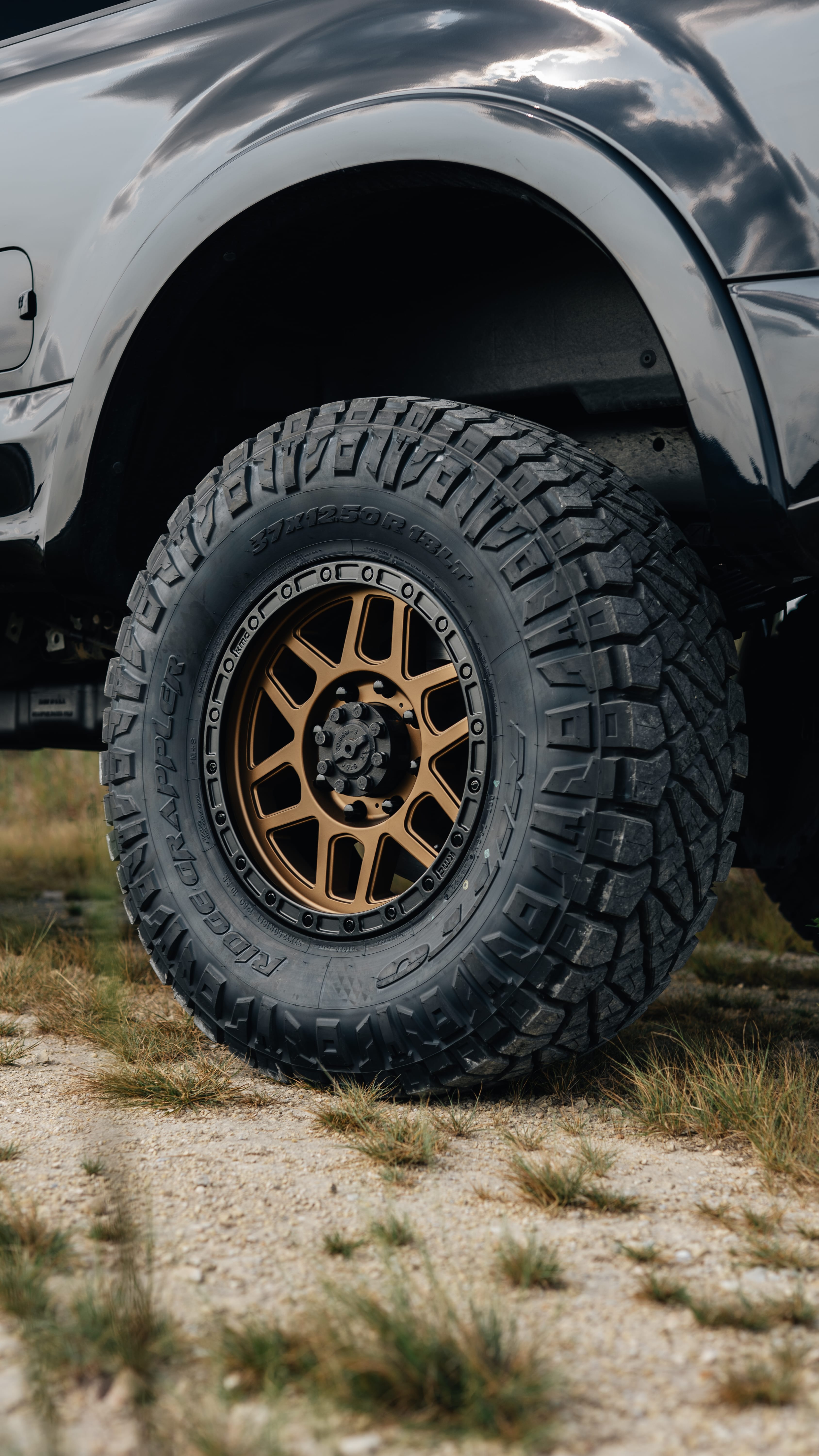 2021 Ford F-250 Super Duty Lariat in Black with Carli 3.5" King Pintop Suspension Kit, Retrax Pro MX Bedcover, 18" KMC Mesa Wheels, AMP Research Steps, Baja Squadron Fog Light Pocket Kit, 37x12.50R18 Ridge Grappler Tires