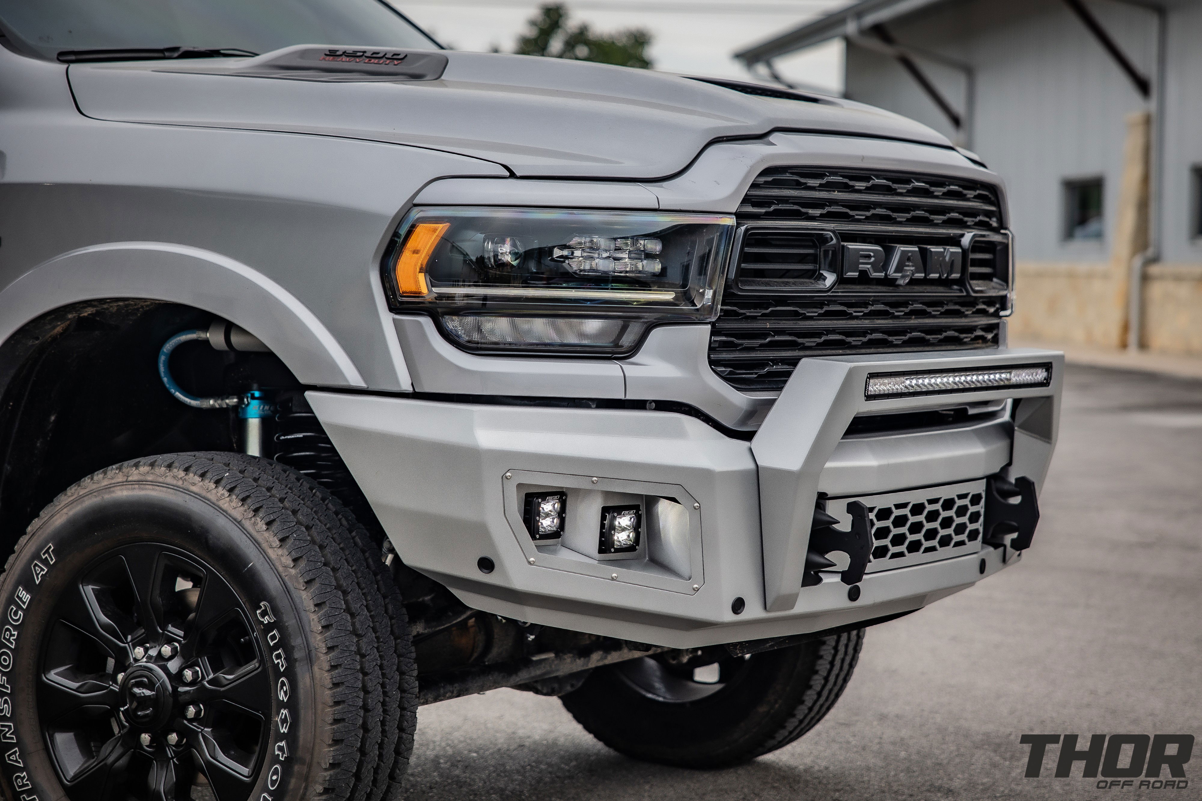 2024 RAM 3500 Limited in Grey with Carli 3.25" King Pintop Suspension, Carli Torsion Sway Bar, Carli High Mount Steering Stabilizer, Carli Low Mount Steering Stabilizer, Carli Fabricated Radius Arms, Flog Industries Steel Demon Series Front Bumper, Rigid D-Series Pro Flood Surface Mount Lights, Rigid D-Series Pro Spot Surface Mount Lights, Rigid SR-Series Pro 30" Spot and Drive Combo Light Bar