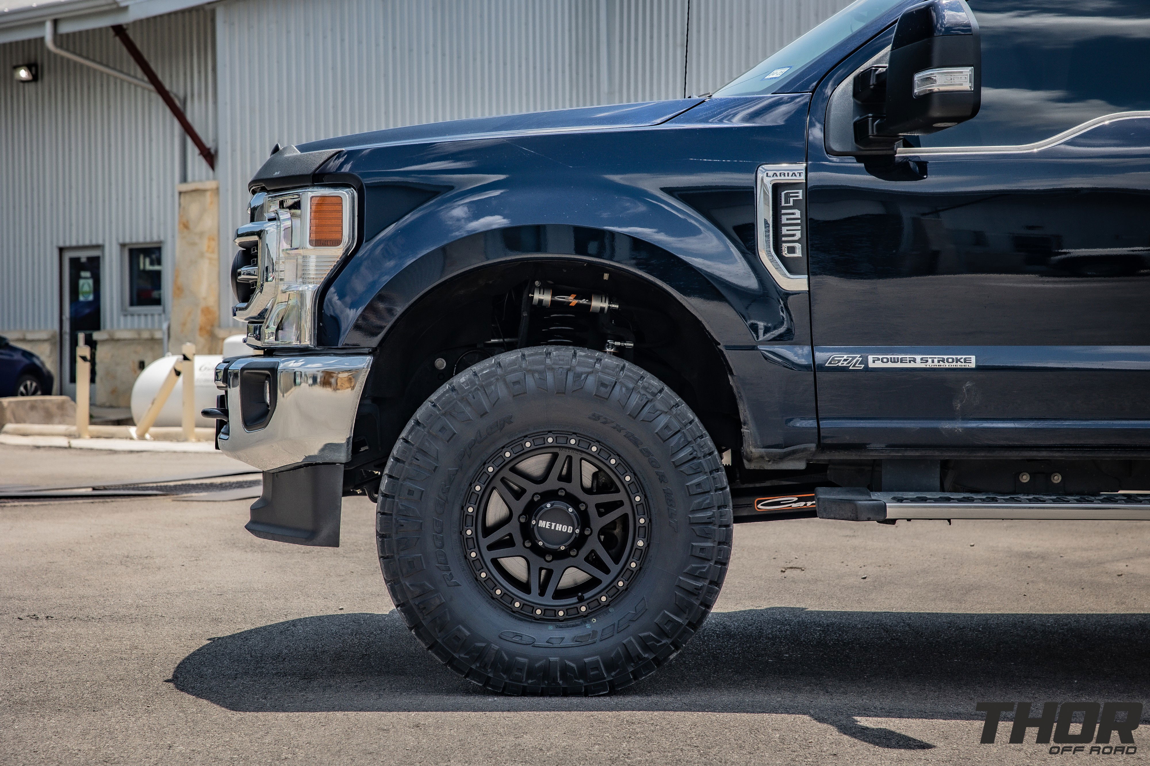 2022 Ford F-250 Super Duty Lariat in Black with Carli Backcountry 3.5" Suspension Kit, Carli 3.5" Full Rear Spring Replacement, Carli 3.5" Fabricated Radius Arms, Fox ATS Steering Stabilizer, Carli Torsion Sway Bar, Method MR312 Matte Black 18x9" Wheels, Nitto Ridge Grappler 37x12.50R18 Tires