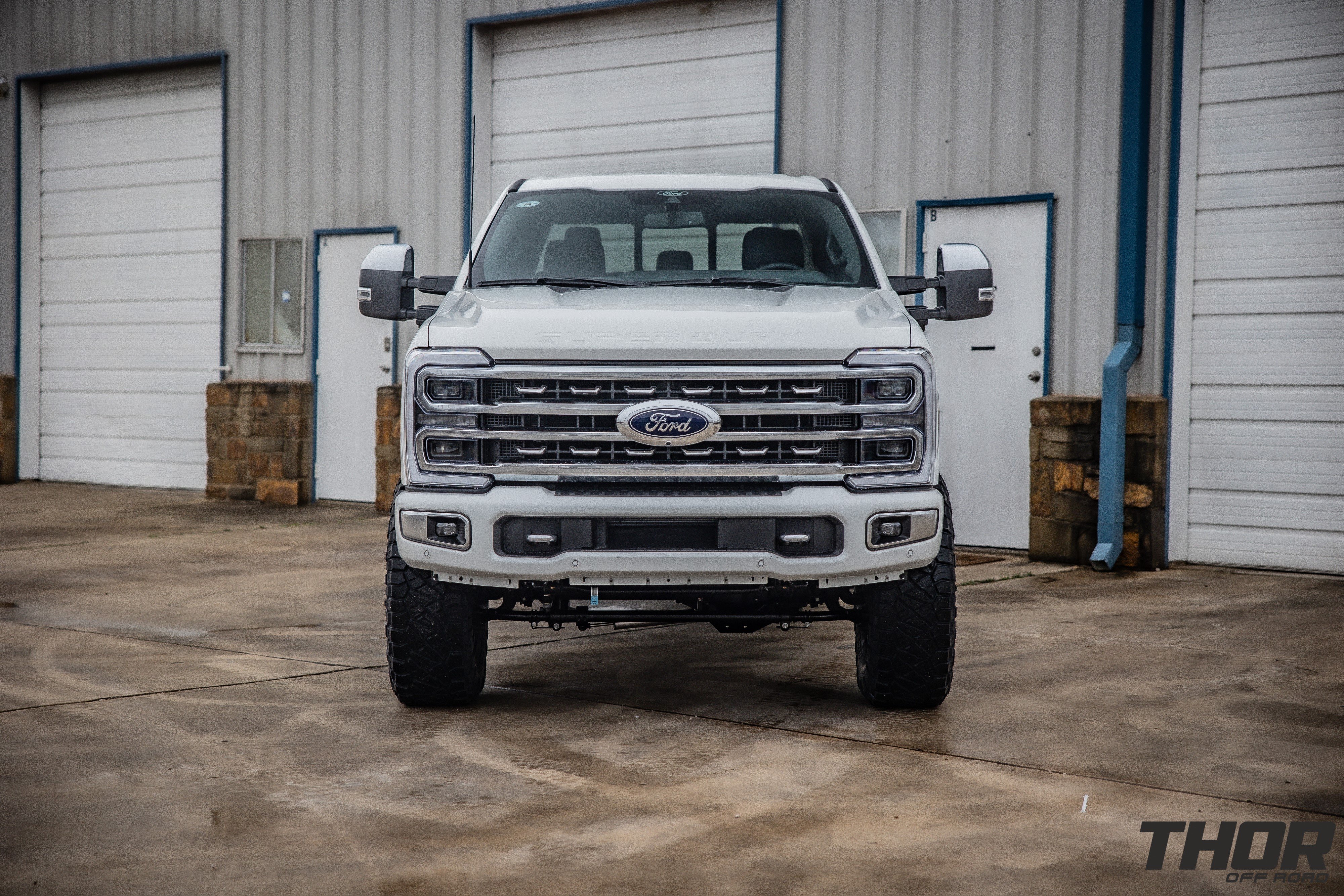 2024 Ford F-250 Super Duty Platinum in White with Carli Backcountry 3.5" Suspension Kit, Carli Sway Bar Drop Bracket, Carli Full Rear Spring Replacement, Carli High Mount Steering Stabilizer, Carli Low Mount Steering Stabilizer, Fuel Blitz 20x9" +20 Wheels, Nitto Ridge Grappler Tires